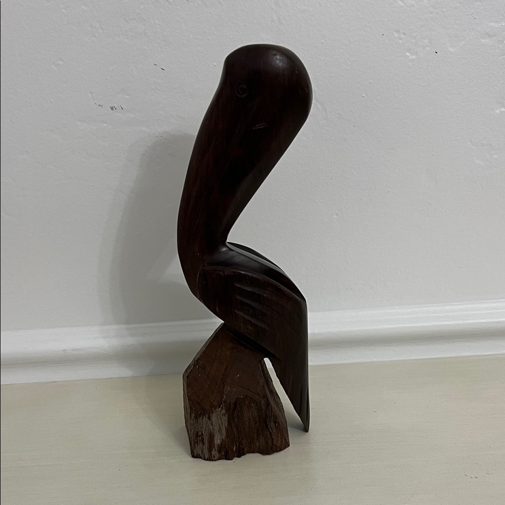 Iron wood pelican sculpture by hand